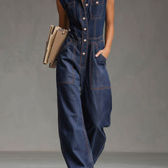 Dark blue denim sleeveless balloon jumpsuit with multiple pockets for women, featuring a relaxed fit and stylish design.