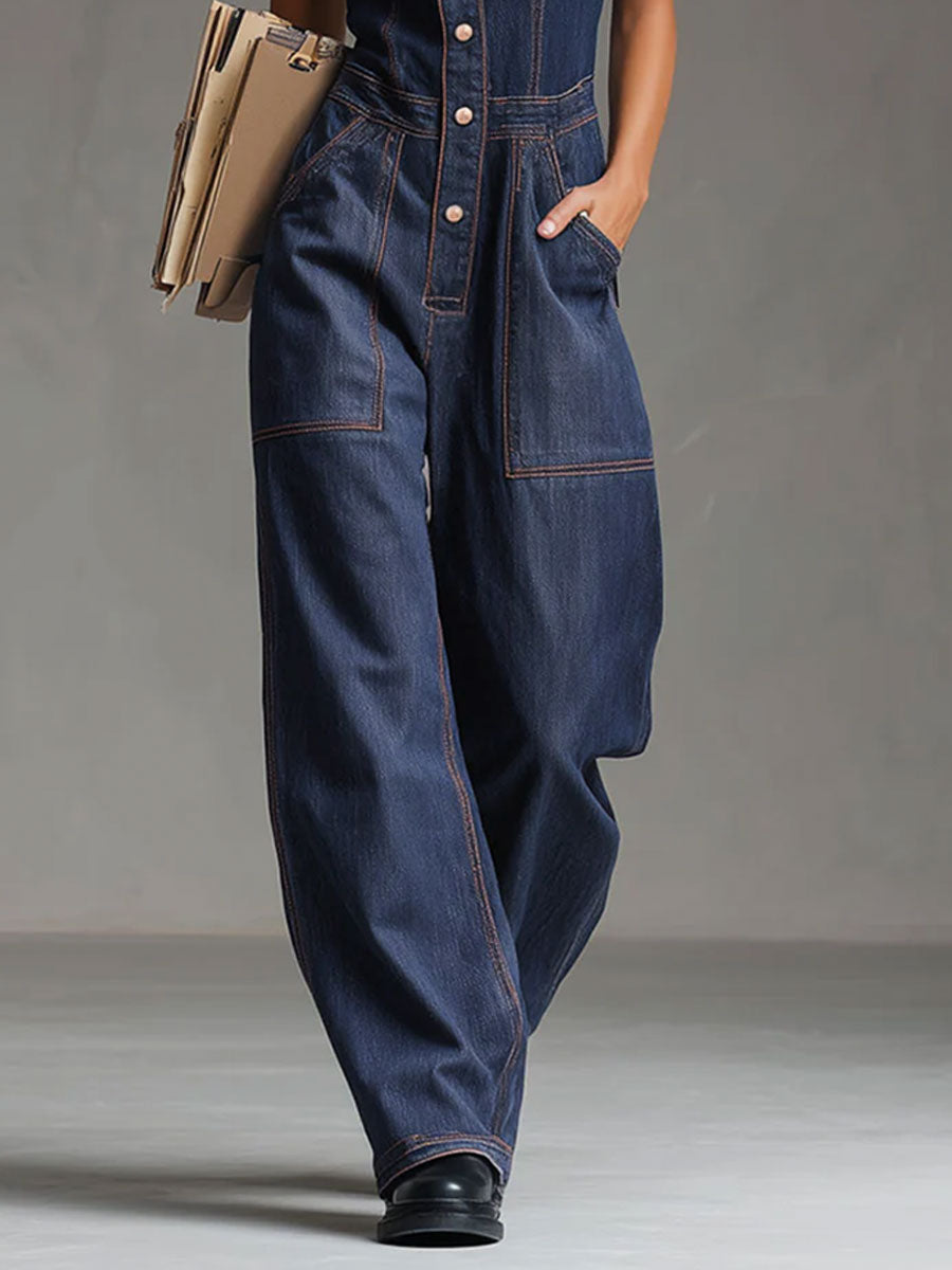 Dark blue denim women’s sleeveless balloon jumpsuit with multiple pockets, featuring a relaxed fit and stylish design.
