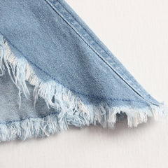 Light blue denim sleeveless raw edge wide-leg jumpsuit for women by Christine Brewer, shown on a hanger.