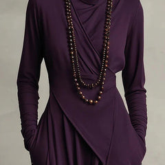 Solid color high-neck long-sleeve irregular casual maxi dress by Christine Brewer, shown on a model with flowing fabric.