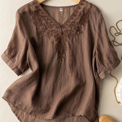 Light beige women's summer blouse by Christine Brewer featuring a V-neckline and flowy linen fabric for casual wear.