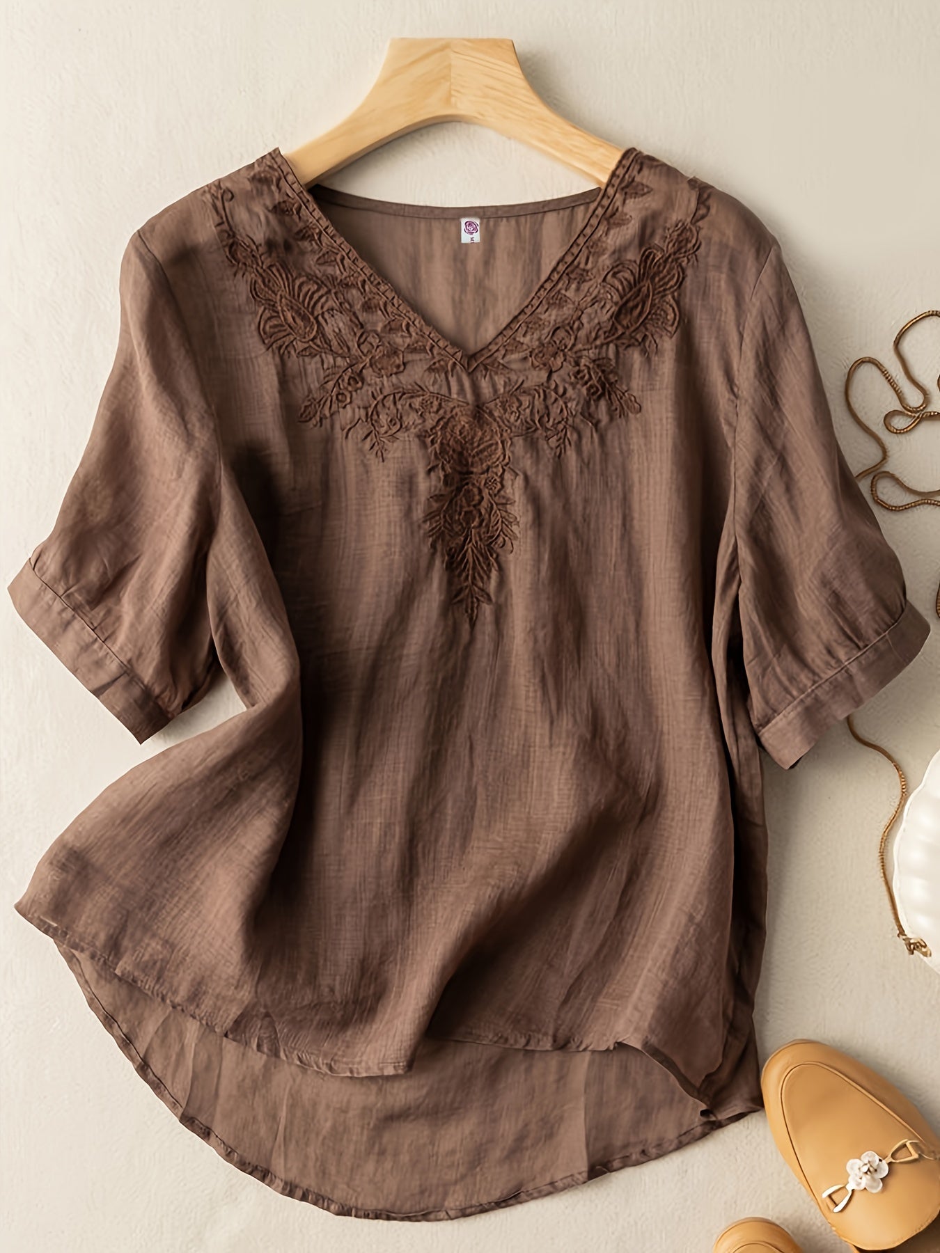 Light beige women's summer blouse by Christine Brewer featuring a V-neckline and flowy linen fabric for casual wear.
