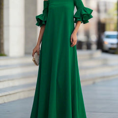 White Christine Brewer maxi dress with half sleeves, loose fit, solid color, off-the-shoulder design, perfect for elegant casual wear.