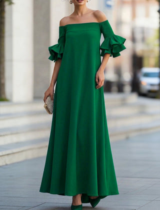 White Christine Brewer maxi dress with half sleeves, loose fit, solid color, off-the-shoulder design, perfect for elegant casual wear.
