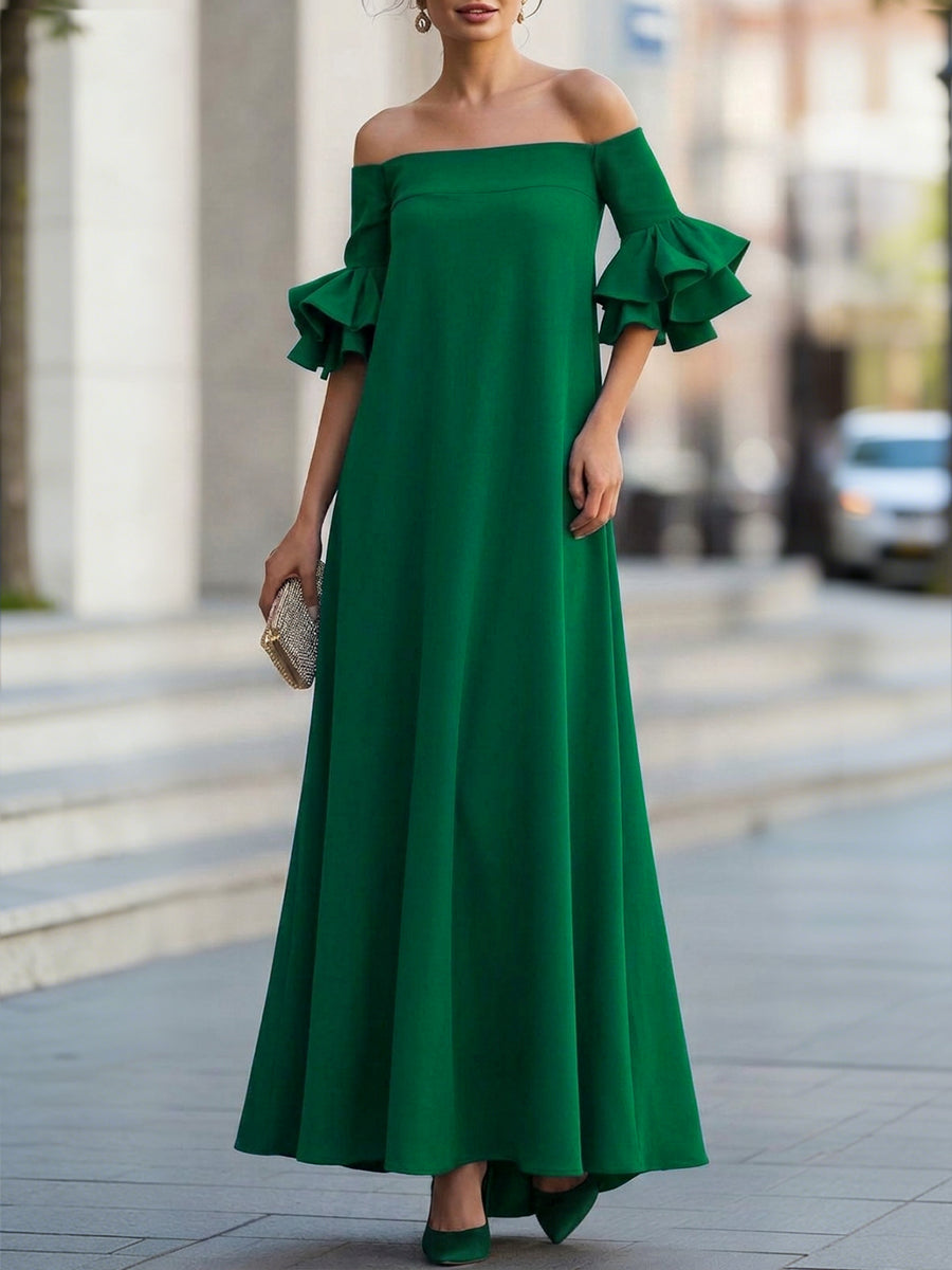 White Christine Brewer maxi dress with half sleeves, loose fit, solid color, off-the-shoulder design, perfect for elegant casual wear.