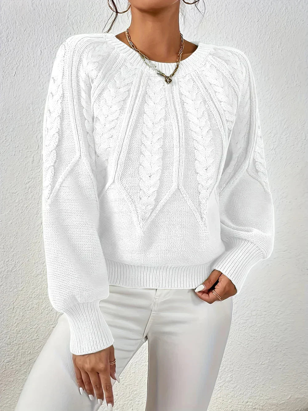 Esme knit sweater for women by Christine Brewer, featuring a cozy, textured fabric and a classic fit, in a neutral color.