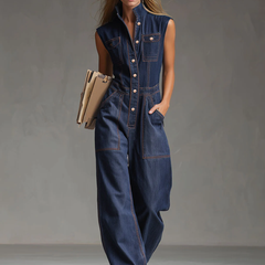 Dark blue denim women's sleeveless balloon jumpsuit with multi-pocket design, featuring a relaxed fit and casual style.