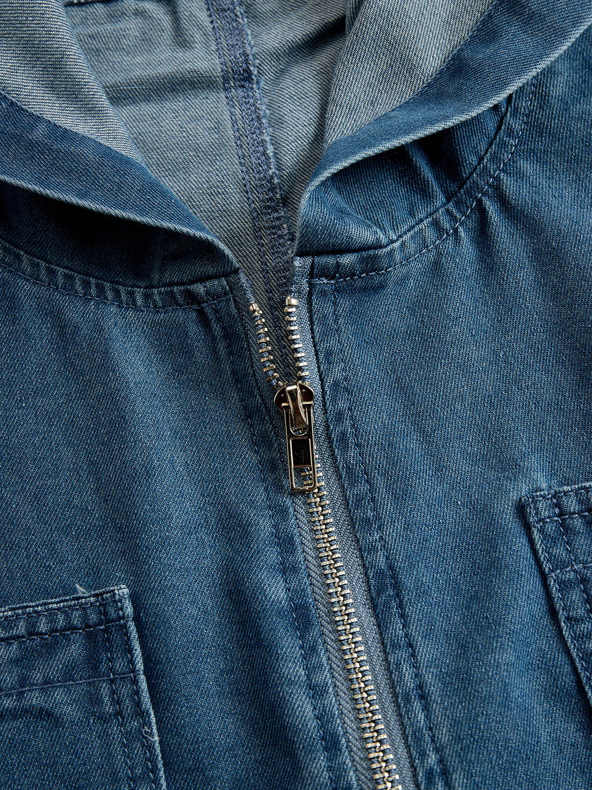 Women's denim jumpsuit with long sleeves, hood, zipper, and retro pockets by Christine Brewer, casual and loose fit.