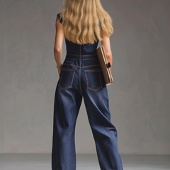 Dark blue denim multi-pocket sleeveless balloon jumpsuit for women by Christine Brewer, showing the relaxed fit and stylish design.