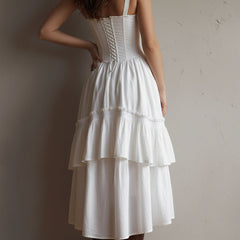 Retro Boho corset tiered midi dress with lace trim, featuring a flowy silhouette and vintage-inspired design by Christine Brewer.
