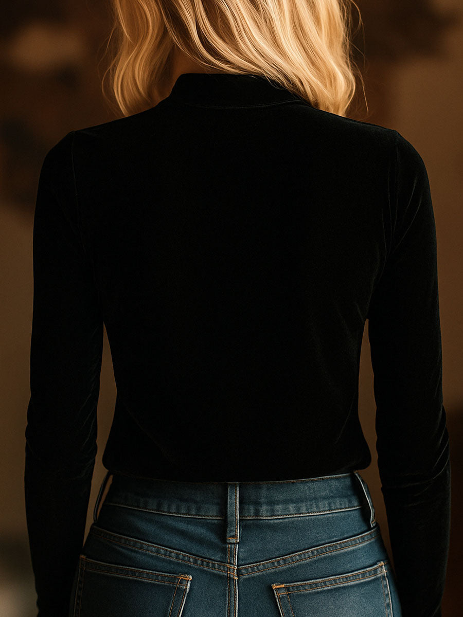 Black velvet long sleeve V-neck top with embroidered details by Christine Brewer, showcasing a stylish and elegant design.