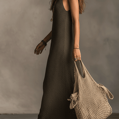 Olive green knit sleeveless maxi dress by Christine Brewer, casual style with a flowing silhouette and lightweight fabric.