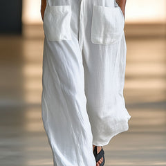 White linen sleeveless wide-leg jumpsuit for women by Christine Brewer, featuring a relaxed fit and stylish design.