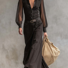 Black denim V-neck maxi dress by Christine Brewer, casual style, featuring a flowing long silhouette and V-shaped neckline.