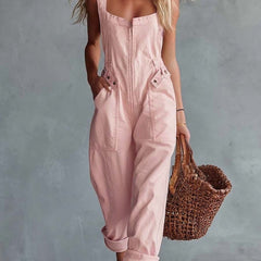 Light yellow denim jumpsuit for women with square neckline and zip-front closure, by Christine Brewer.