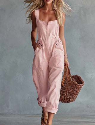 Light yellow denim jumpsuit for women with square neckline and zip-front closure, by Christine Brewer.