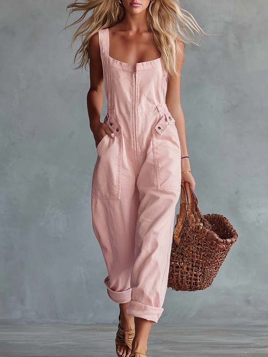 Light yellow denim jumpsuit for women with square neckline and zip-front closure, by Christine Brewer.