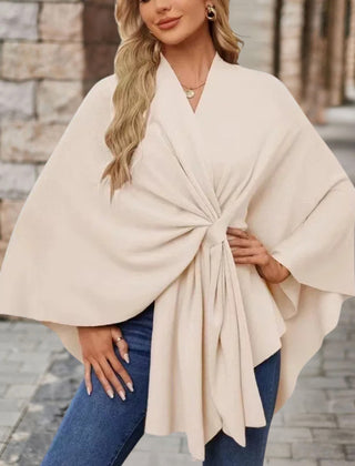 Christine Brewer Cecilia knit poncho for women, stylish and cozy top with a draped, textured fabric in neutral tones.