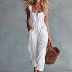 Light yellow denim jumpsuit with square neckline and zip-front closure, designed for women by Christine Brewer.