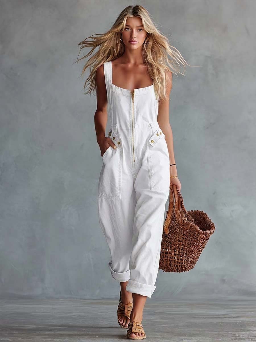 Light yellow denim jumpsuit with square neckline and zip-front closure, designed for women by Christine Brewer.