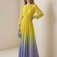 Christine Brewer high waisted maxi dress with long sleeves, belt, contrast color gradient, pleated design, and round neck.