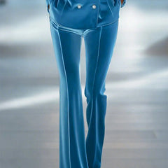 Blue loose velvet flared trousers for women by Christine Brewer, showing the relaxed fit and stylish flare detail.