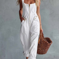 Light yellow denim square neck zip-front jumpsuit for women by Christine Brewer, featuring long sleeves and a fitted waist.