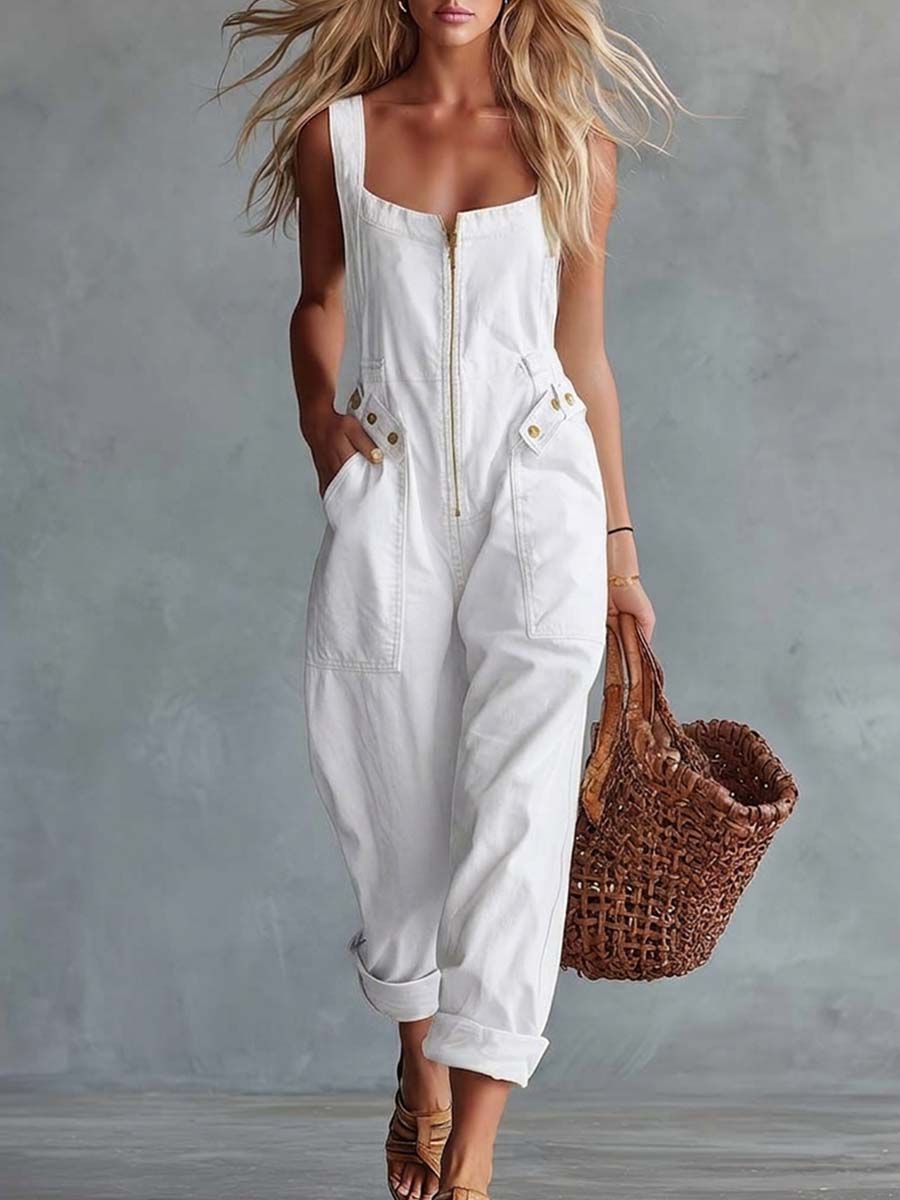 Light yellow denim square neck zip-front jumpsuit for women by Christine Brewer, featuring long sleeves and a fitted waist.