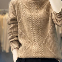 Women's cable knit turtleneck sweater by Christine Brewer, featuring a cozy design and classic turtleneck style.