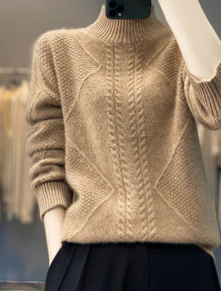 Women's cable knit turtleneck sweater by Christine Brewer, featuring a cozy design and classic turtleneck style.