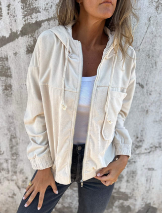 Women’s Adeline hooded jacket by Christine Brewer, featuring a stylish hood and cozy fit, shown in a neutral color.