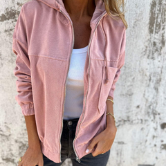 Women’s Adeline hooded jacket by Christine Brewer, featuring a stylish, cozy design with a front zipper and adjustable hood.