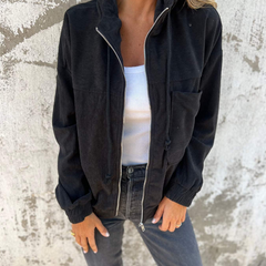 Adeline women's hooded jacket by Christine Brewer, featuring a stylish, lightweight design with a front zipper and adjustable hood.