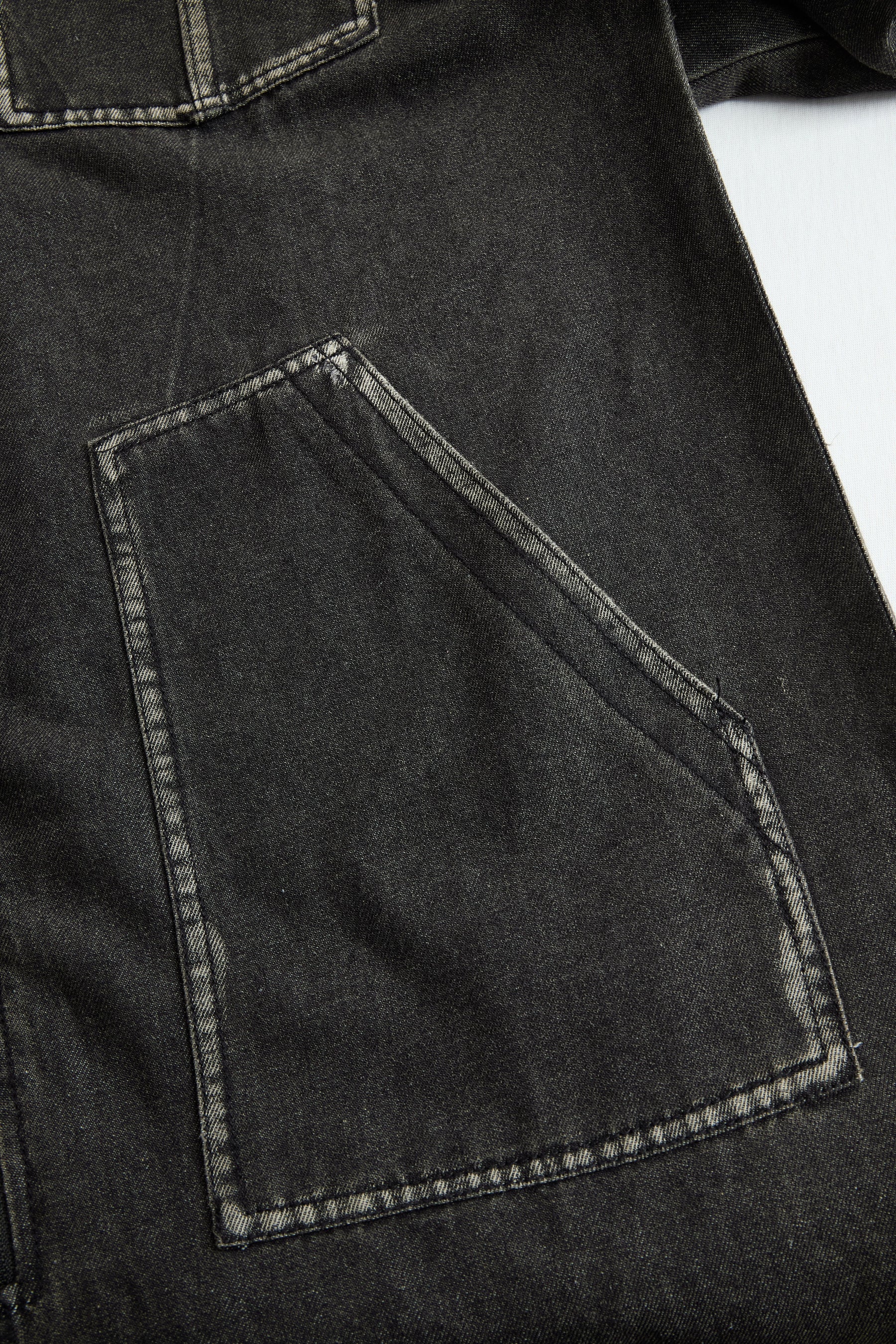 Women’s casual loose denim jumpsuit with hood, zipper, and retro pockets by Christine Brewer, featuring long sleeves and a relaxed fit.
