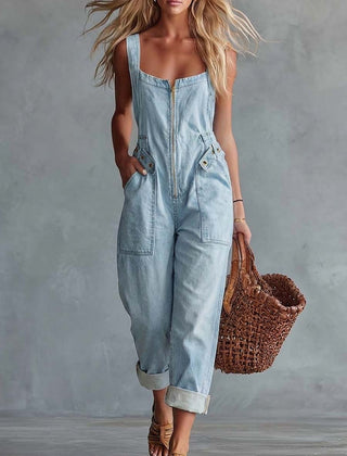 Light yellow denim jumpsuit for women with square neckline and zip-front, designed by Christine Brewer.