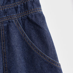 Dark blue denim sleeveless balloon jumpsuit with multiple pockets, designed for women by Christine Brewer.