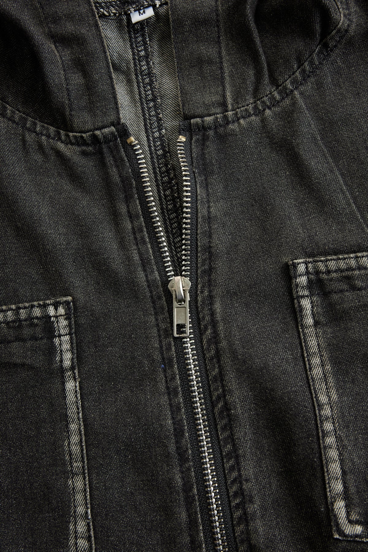 Women’s casual loose-fit denim jumpsuit with retro pockets, long sleeves, hood, and zipper by Christine Brewer.