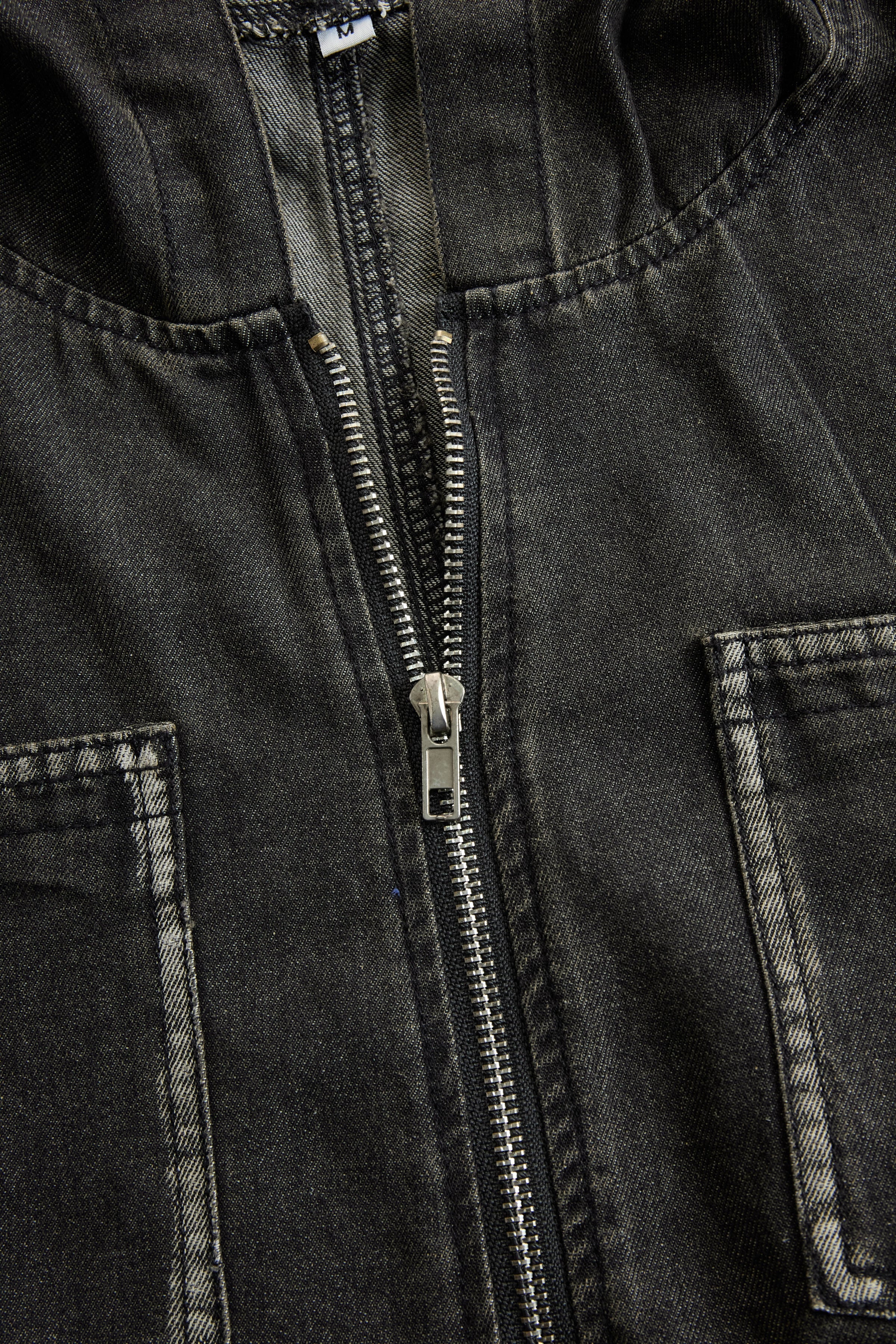 Women’s casual loose-fit denim jumpsuit with retro pockets, long sleeves, hood, and zipper by Christine Brewer.