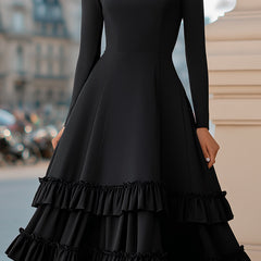 Black high-neck A-line tiered ruffle midi dress by Christine Brewer, featuring elegant ruffle details and a classic silhouette.