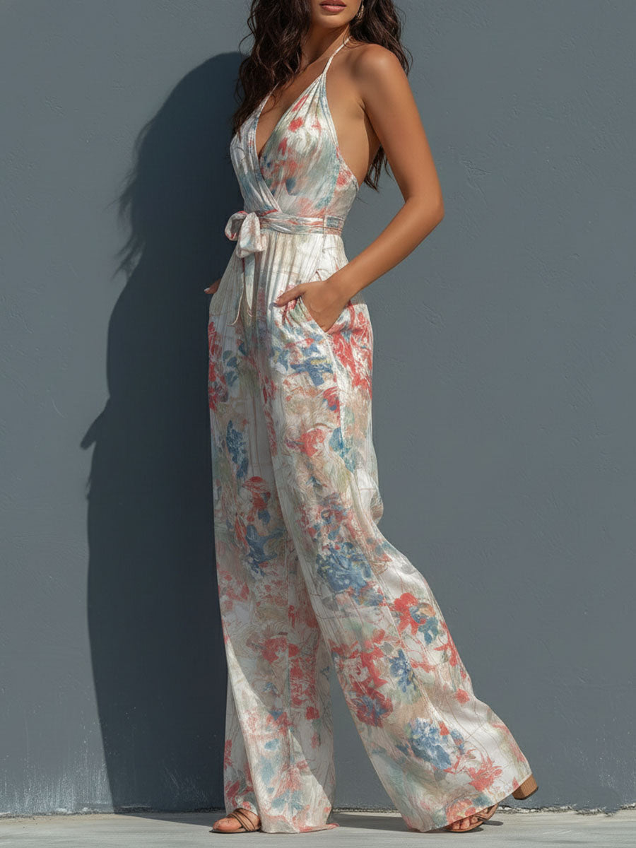 White floral satin halter neck jumpsuit with wrap front and wide-leg pants for women by Christine Brewer.