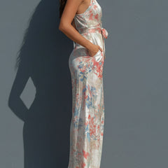 White floral satin halter neck wide-leg jumpsuit for women with wrap front by Christine Brewer, featuring a stylish and elegant design.