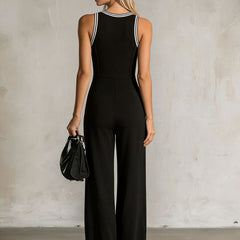 Black colour-block V-neck sleeveless jumpsuit with button-down front and wide-leg pants for women by Christine Brewer.