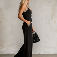 Black color-block V-neck sleeveless jumpsuit with button-down front, women's pants by Christine Brewer.