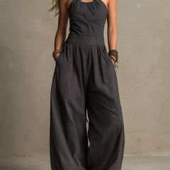 Women's charcoal pinstripe halter neck wide-leg jumpsuit by Christine Brewer, featuring a stylish halter top and flowing wide-leg pants.