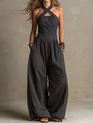 Women's charcoal pinstripe halter neck wide-leg jumpsuit by Christine Brewer, featuring a stylish halter top and flowing wide-leg pants.