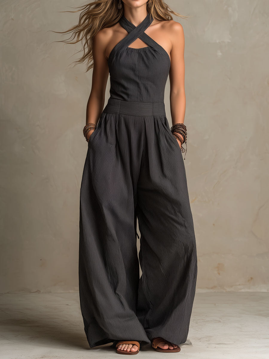 Women's charcoal pinstripe halter neck wide-leg jumpsuit by Christine Brewer, featuring a stylish halter top and flowing wide-leg pants.