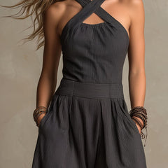 Charcoal pinstripe halter neck wide-leg jumpsuit for women with sleeveless design and tailored fit, by Christine Brewer.