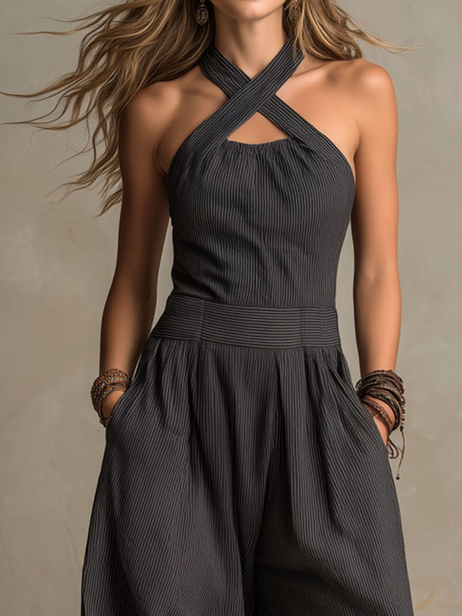 Charcoal pinstripe halter neck wide-leg jumpsuit for women with sleeveless design and tailored fit, by Christine Brewer.