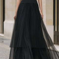 Elegant black tiered tulle maxi dress by Christine Brewer, featuring flowing layers and a sophisticated silhouette.