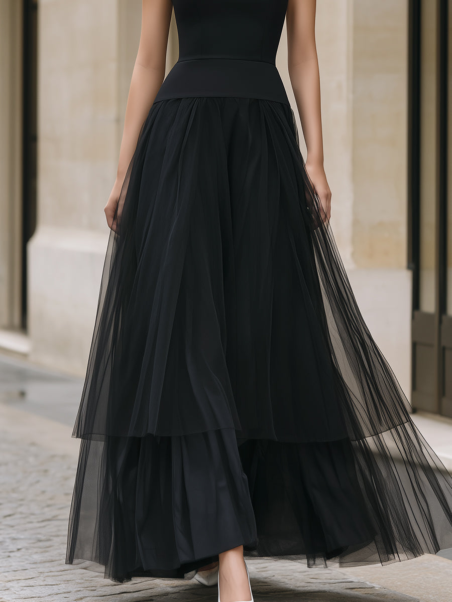 Elegant black tiered tulle maxi dress by Christine Brewer, featuring flowing layers and a sophisticated silhouette.